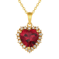Close up of the 14K Gold Ruby Heart Necklace highlighting the precision-cut AAAAA ruby red zirconia and the polished 14K gold-plated setting.
