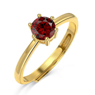 Close-up of a woman's hand wearing the personalized 14K gold birthstone ring from the Diamond Series