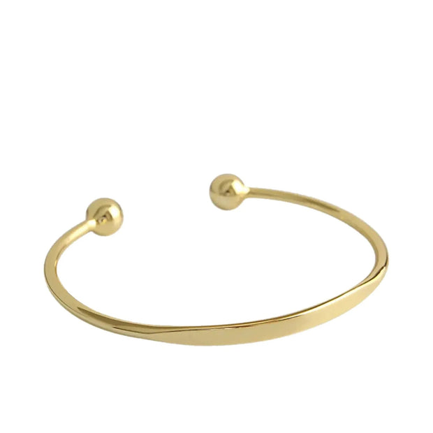 Personalized Letter Bangle in 18K gold-plated 925 silver, an open cuff with ball ends, on white