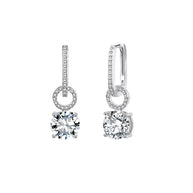 Pair of 925 silver interchangeable hoops with blue and clear zirconia drops on white.