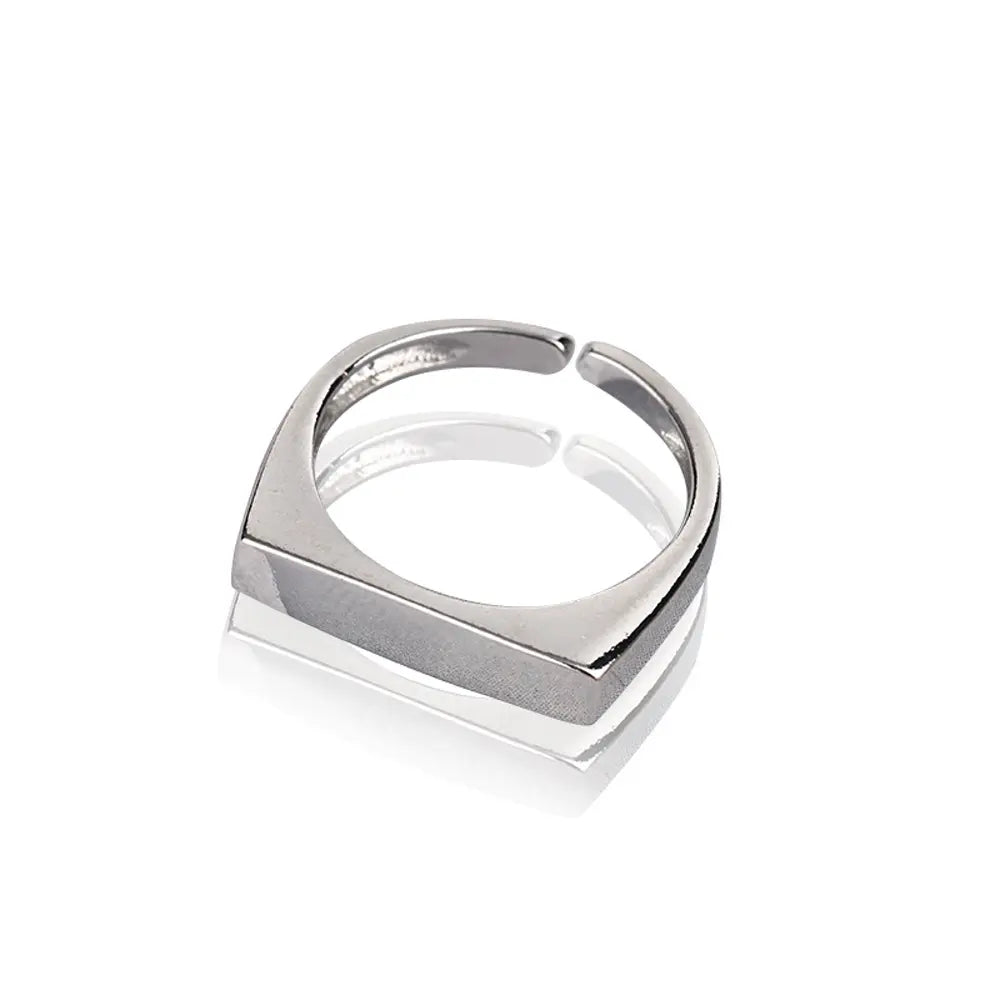Close-up of a woman's hand wearing the personalized silver engravable rectangle ring.