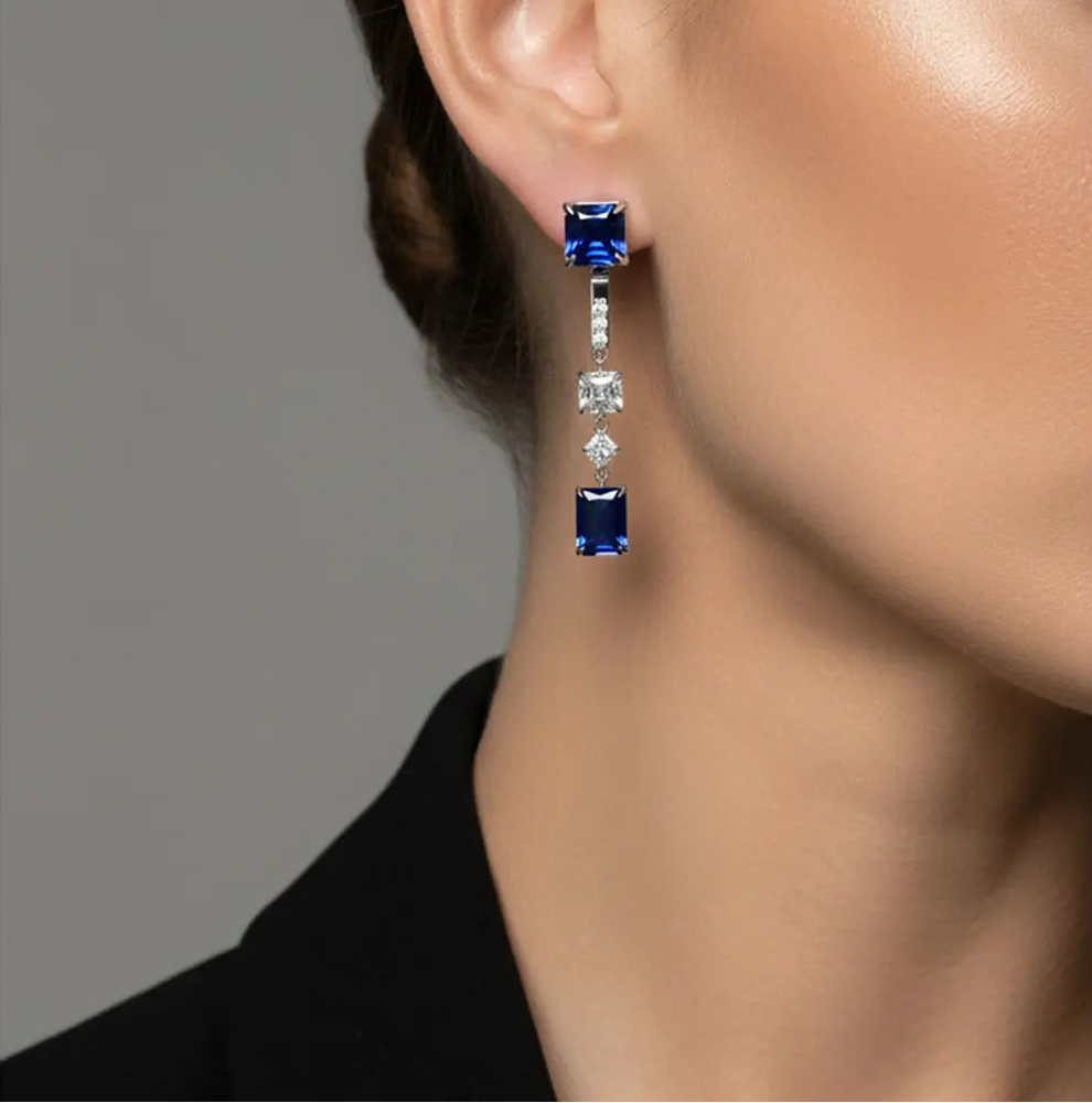 Close up of the 925 Silver Blue Duo Earrings demonstrating the detachable 2-in-1 mechanism and rhodium finish.