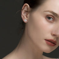 Close up of the 925 Silver Round Solitaire Studs highlighting the secure four-prong setting and the mirror-bright rhodium finish.
