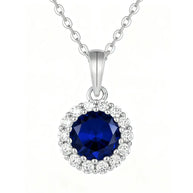 925 Silver Sapphire Halo Necklace in hallmarked 925 sterling silver with a deep blue halo pendant displayed on a pure white background.