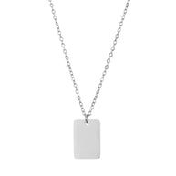 Close up of high-polish square silver pendant showing custom laser engraving