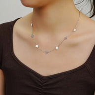 925 silver clover pearl necklace styled in a modern curated layered neckline