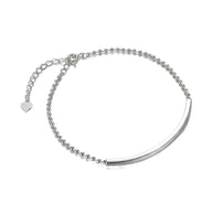Close up of 925 silver curved bar bracelet showing custom engraving and zirconia setting