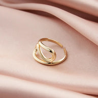 Close-up of a woman's hand wearing the modern 14K gold-plated geometric adjustable ring.