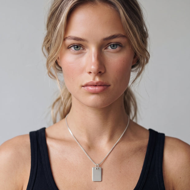 Model wearing the Engraved Square Necklace in 925 sterling silver on a box chain