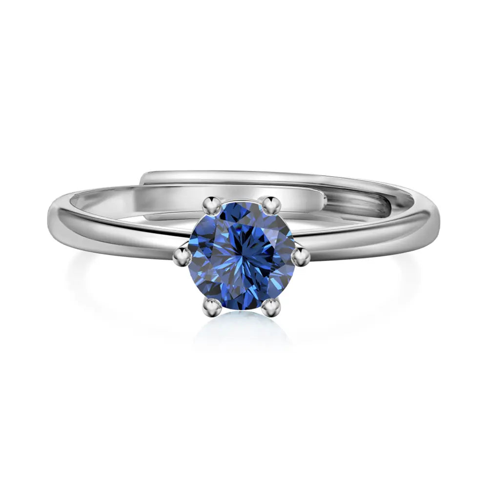 Close-up of the silver birthstone ring highlighting the open-back adjustable 925 sterling silver band.