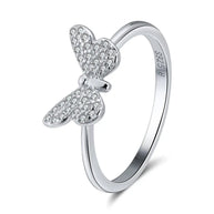 Close detail of the silver butterfly filigree ring showing pierced openwork wings, AAAAA cubic zirconia along the edges, rhodium plating over 925 sterling silver. Hallmarked Loretana piece, hand-finished in Kaunas.
